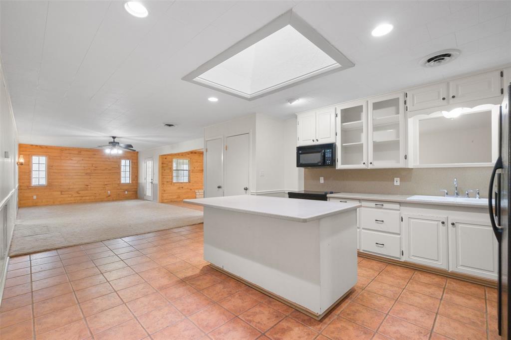 The skylight brings in a ton of natural light to this oversized kitchen!