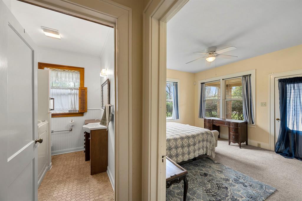 Second bath has been beautifully updated as well. A glimpse of the second of three oversized bedrooms.