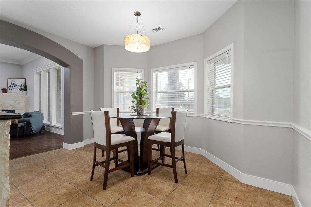 Kitchen eat in nook with chair rail.