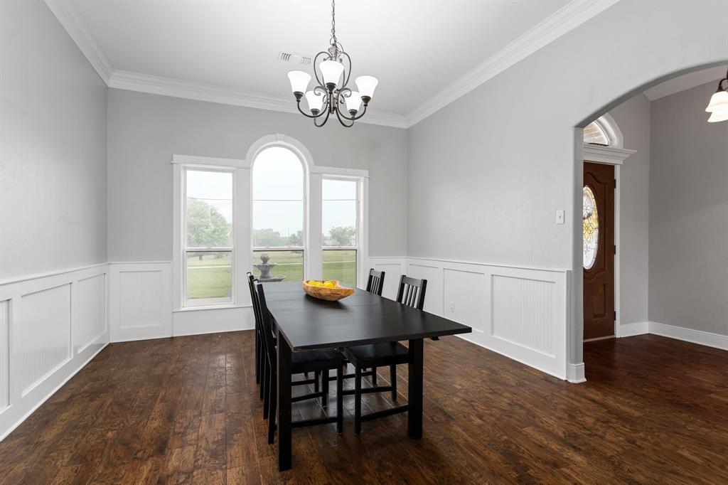 Wainscoting & crown molding in formal dining room.