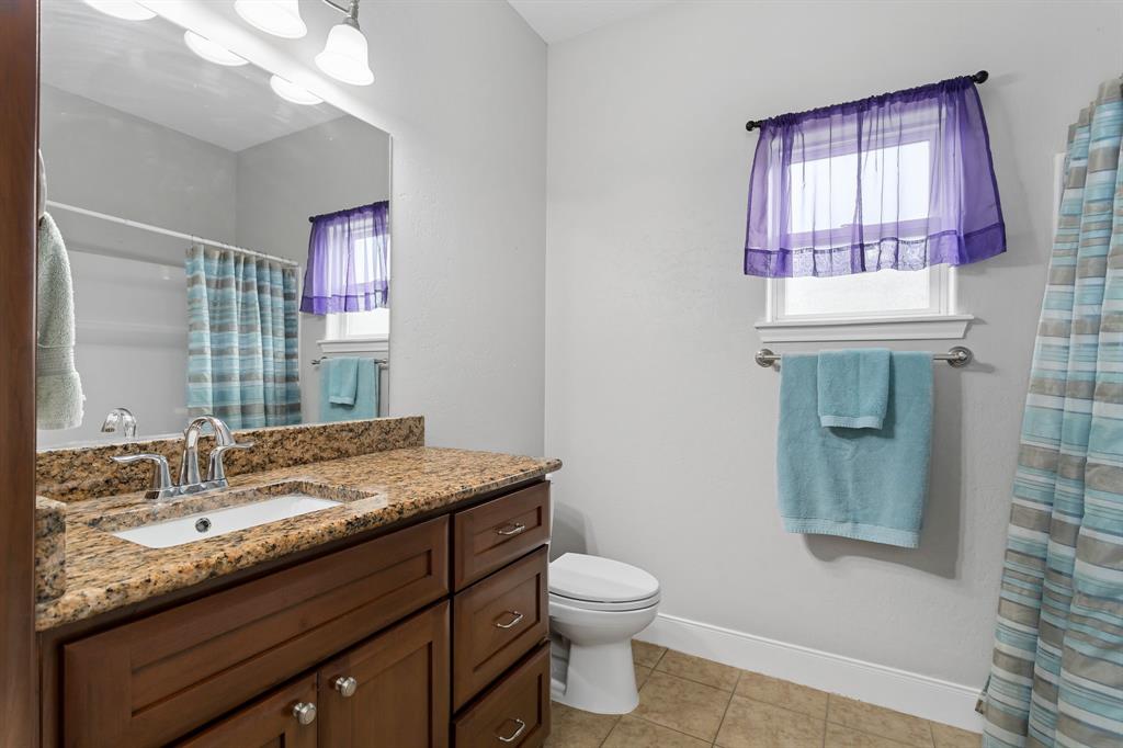 2nd spare bathroom.  Granite countertops & tile flooring.