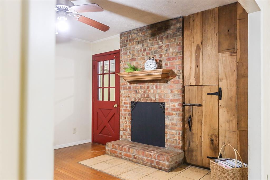 Brick wood burning fireplace. Custom built area to the right for wood storage.