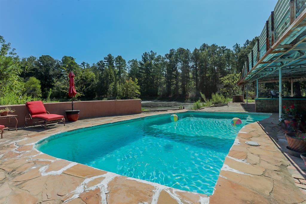 View of swimming pool towards lake.