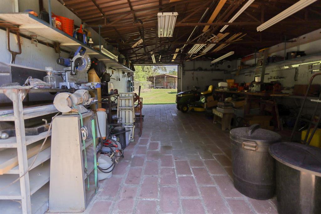 Workshop has sliding doors on each end and you can drive thru.