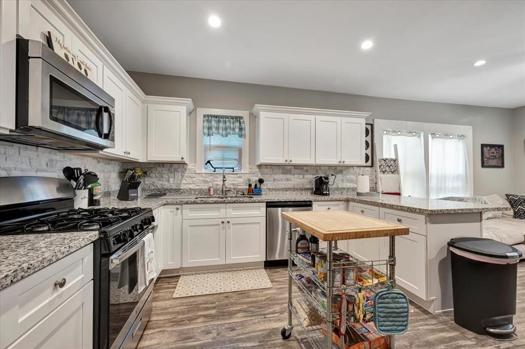 What a roomy kitchen offering abundant counter space, cabinets and all essential appliances