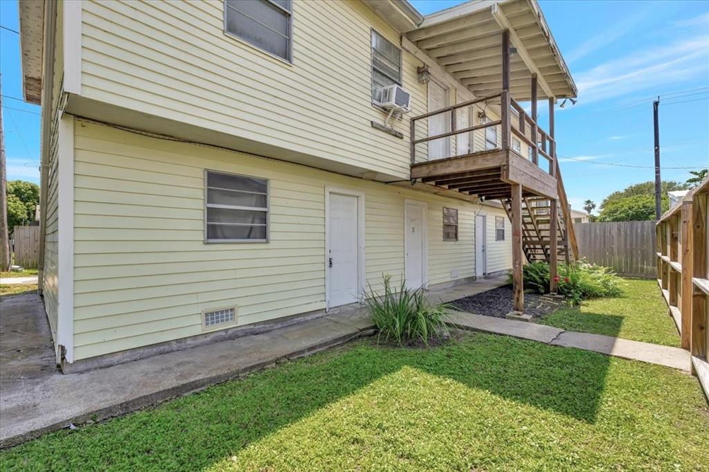 Doors are the individual entrances to the garage spaces and washer dryer for the two units above.