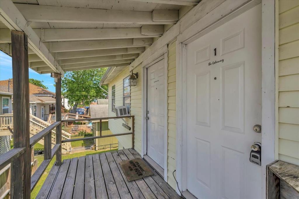 This is the upstairs covered patio and entrance to both the one bedroom units