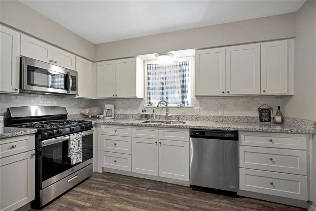 Beautifully remodeled kitchens in all three units. This is the one bedroom unit upstairs in the right. Unit on the left is not pictured but they are identical mirrored units