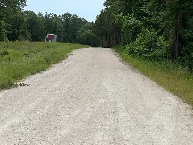 Road past the property heading toward the boat ramp and community office