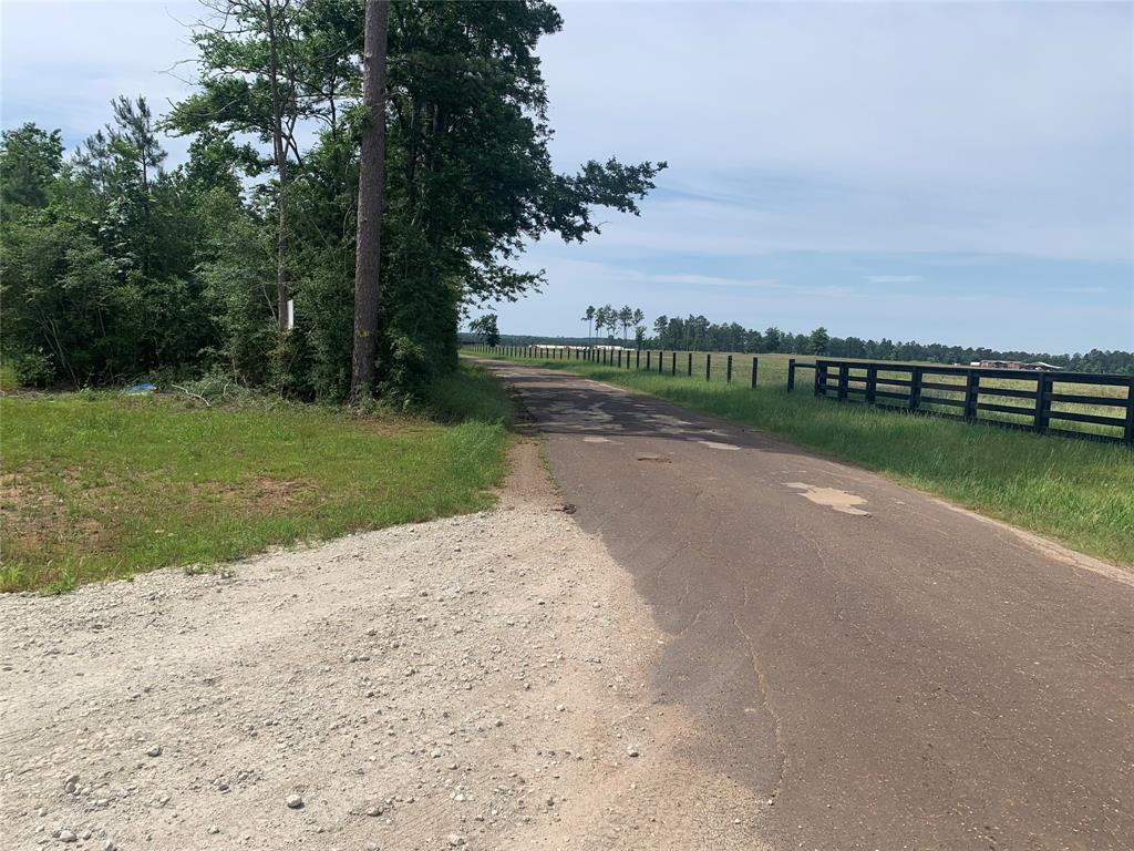 County road 779 leading up to Greg Haymon Rd intersection and community gated entrance