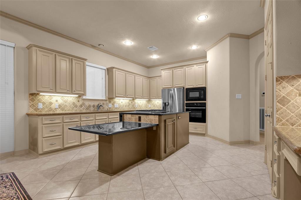 Stunning kitchen with a spacious island and ample counter space, perfect for both cooking and entertaining.