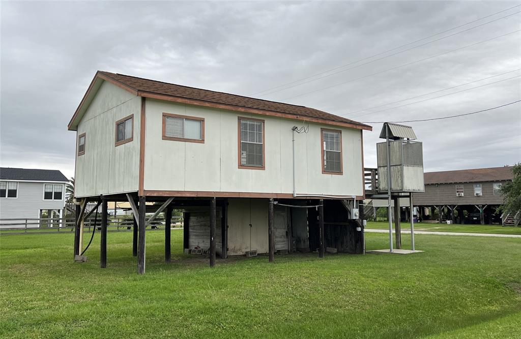 Side view of home, storage below home and elevator.