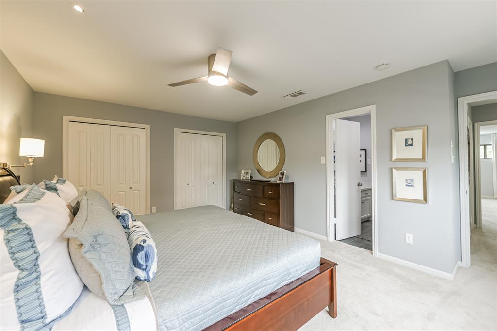 Secondary bedroom provides ample storage with a wall of closets.