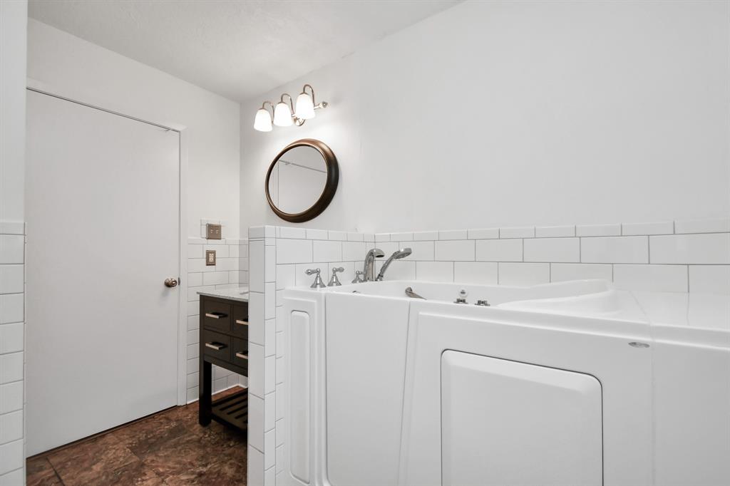 Guest Bath features a Step-In Tub