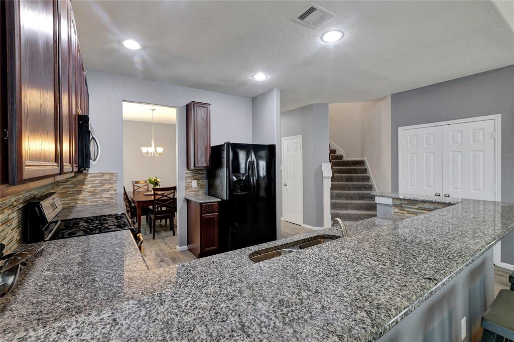 Another view of the open concept kitchen, dining room and living room.