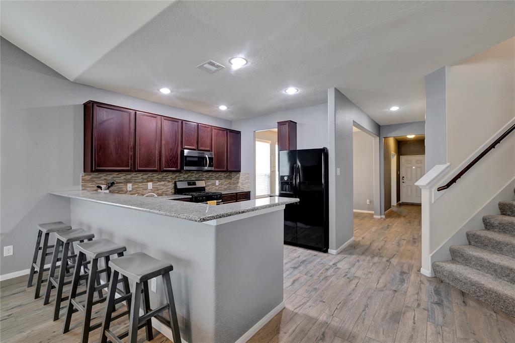 Breakfast bar and stairs to second floor.