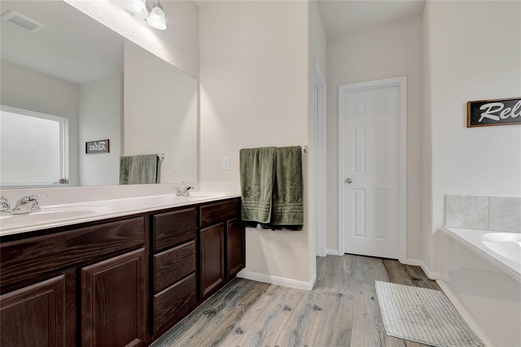 Primary bath has double sinks, private water closet and walk-in closet.