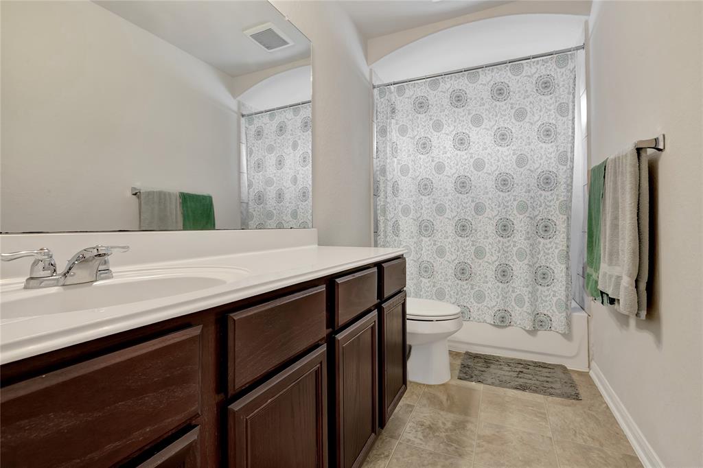 Guest bath with shower/tub combination.