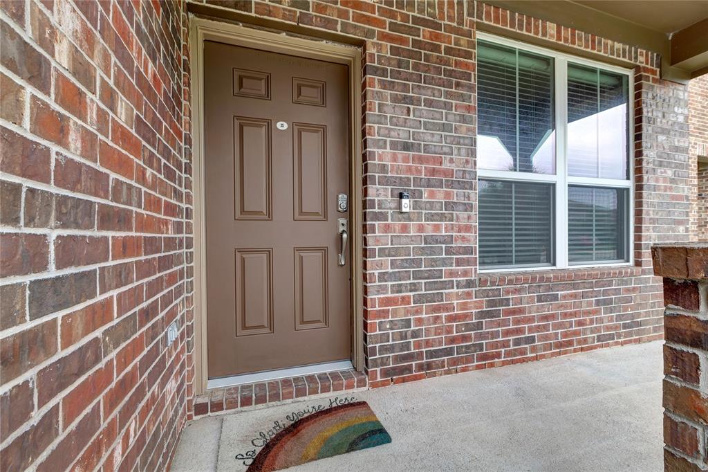 Welcome Home to a covered front porch with space for rocking chairs.