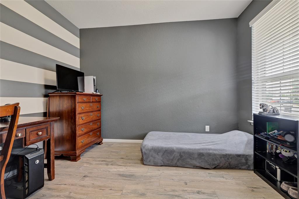 This home office at the front of the house is being used as a downstairs bedroom and a set of doors were added for privacy.