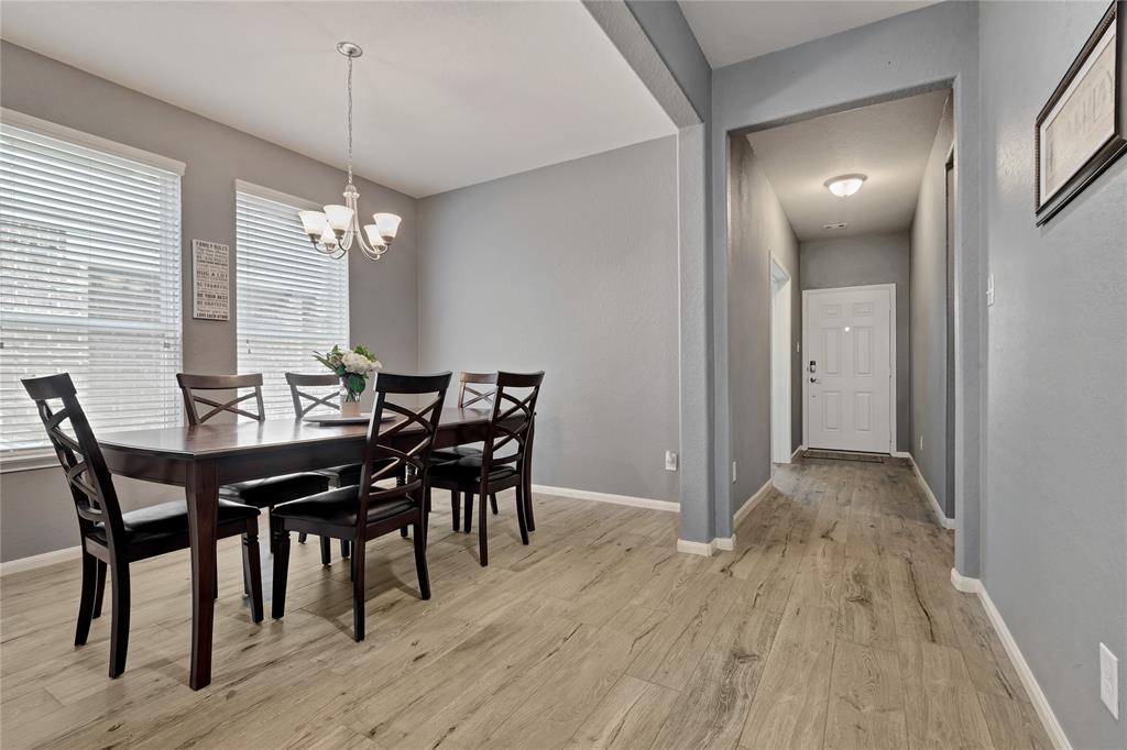 Formal Dining Room and gorgeous tile floors.  Plenty of natural light from the large windows.