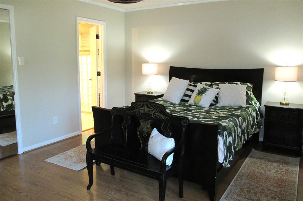 Primary Bedroom with mirrored walk-in closet door