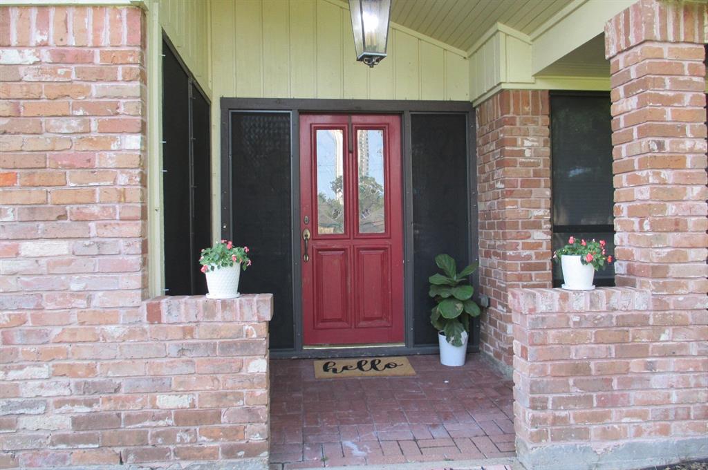 Covered entryway with lots of places for your special touch.