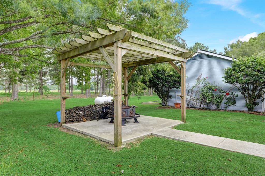 Outdoor fire pit and pergola for summer night fires and stores.