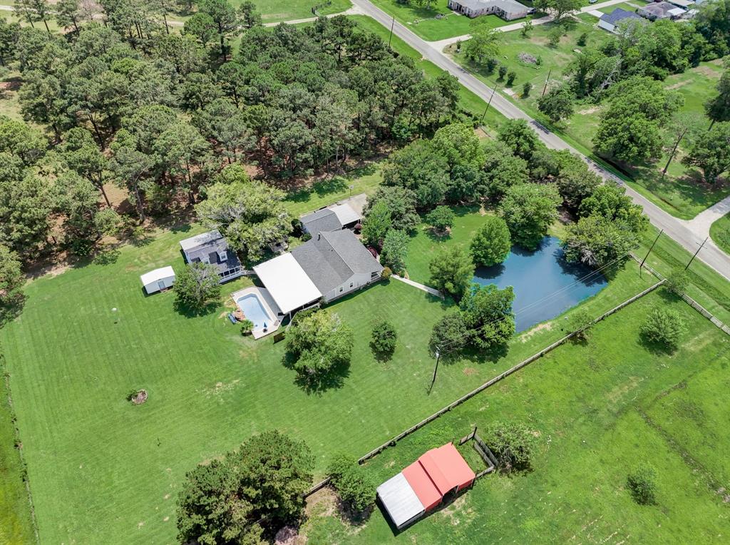 Aerial view of the expansive property. Its fenced and cross fenced for livestock.