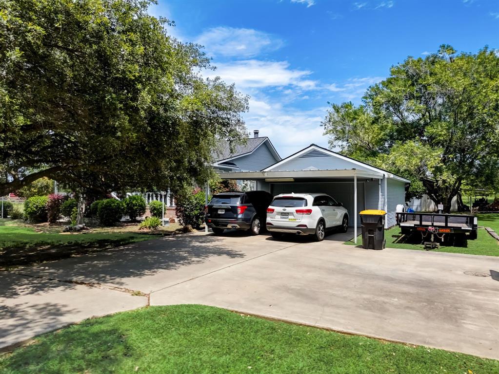 Detached oversized 2 car garage with 2 car carport