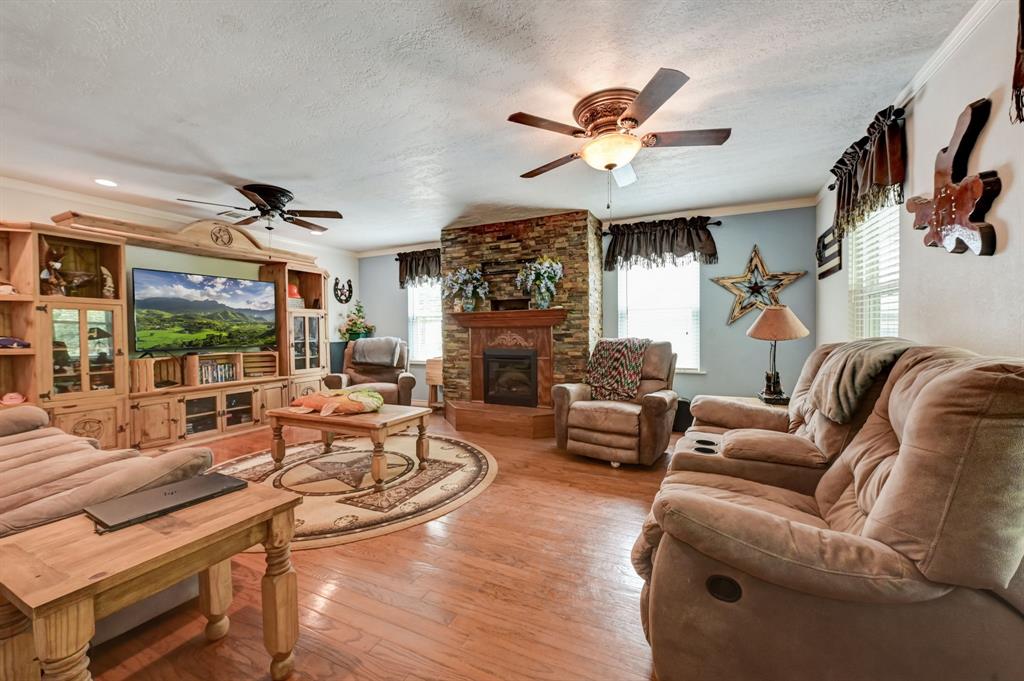 Spacious living room with fireplace offer a cozy and inviting space to relax.