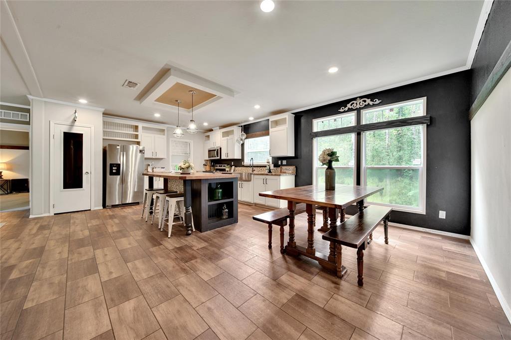 Large Dining space with floor to ceiling windows overlooking the backyard!