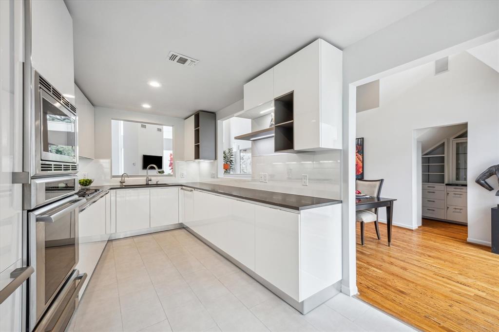 The Kitchen opens to the Dining Room.