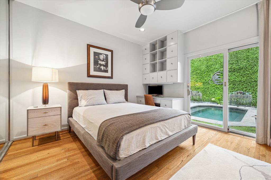 The secondary Bedroom has a built in desk and access to the pool.