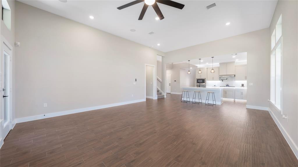 Virtually staged dining area and living room.