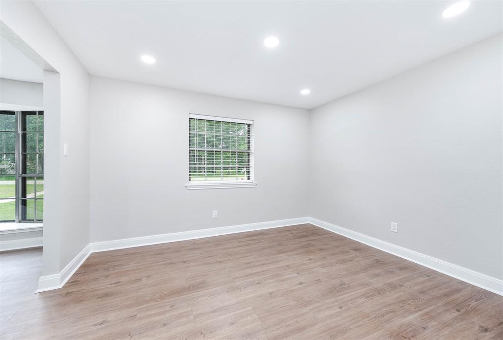 This room is located next to the kitchen and could be a formal dining room.