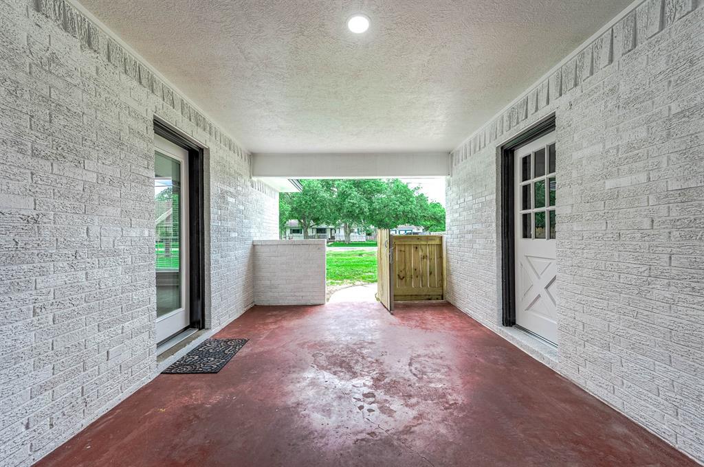 This breezeway can be used as a welcoming and relaxing sitting space.