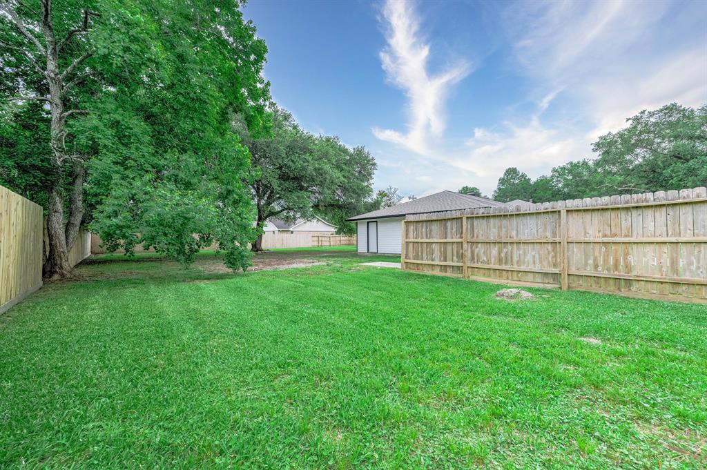 SIDE VIEW OF THE PROPERTY FROM THE SIDE GATE AREA.