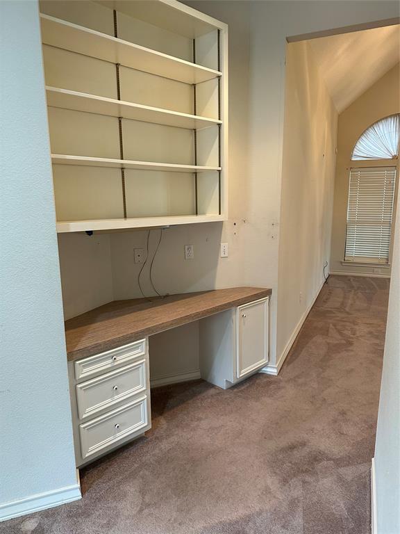 Office nook area in the hallway leading into the family room