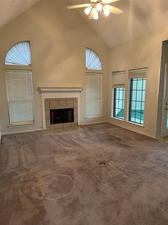 Family room or den with gas log fireplace and high ceilings