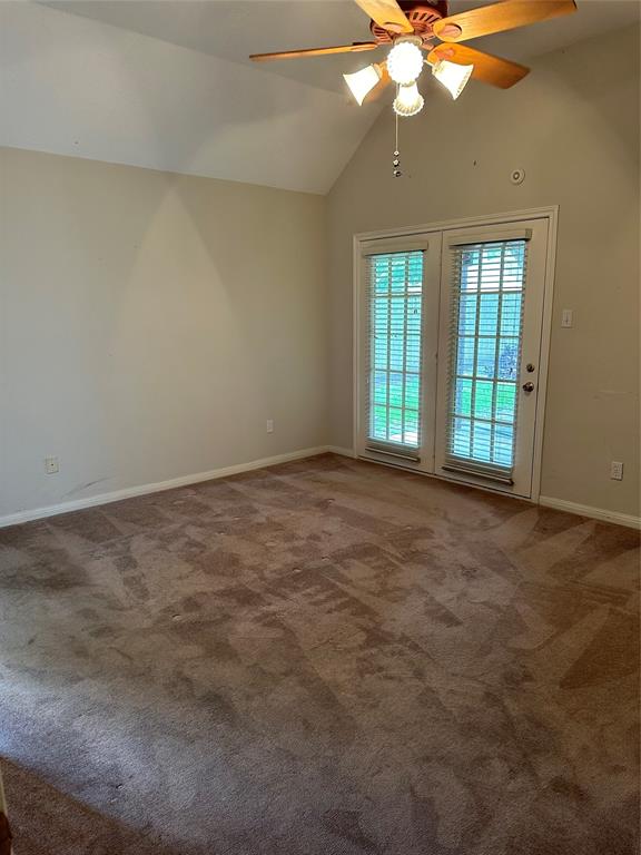 Primary bedroom with doors to private patio