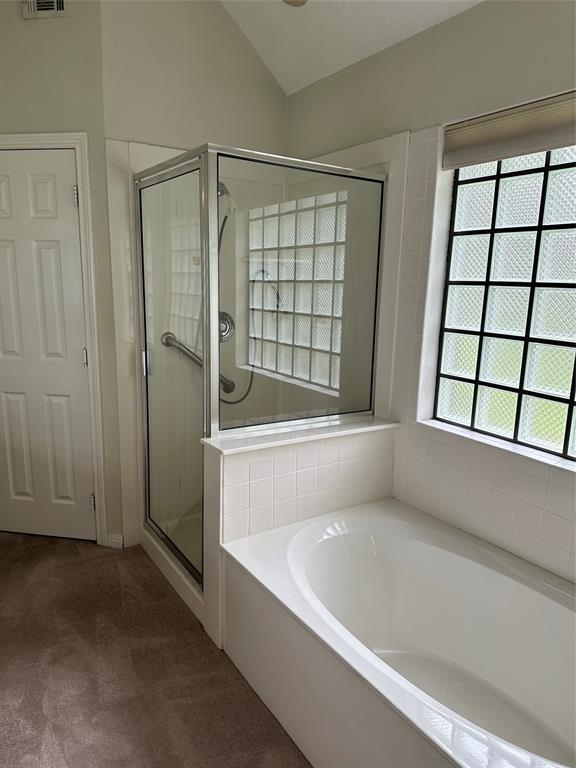 Primary bath room with soaker tub and separate shower