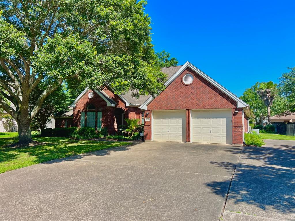 Nice brick home with extended driveway space for additional parking