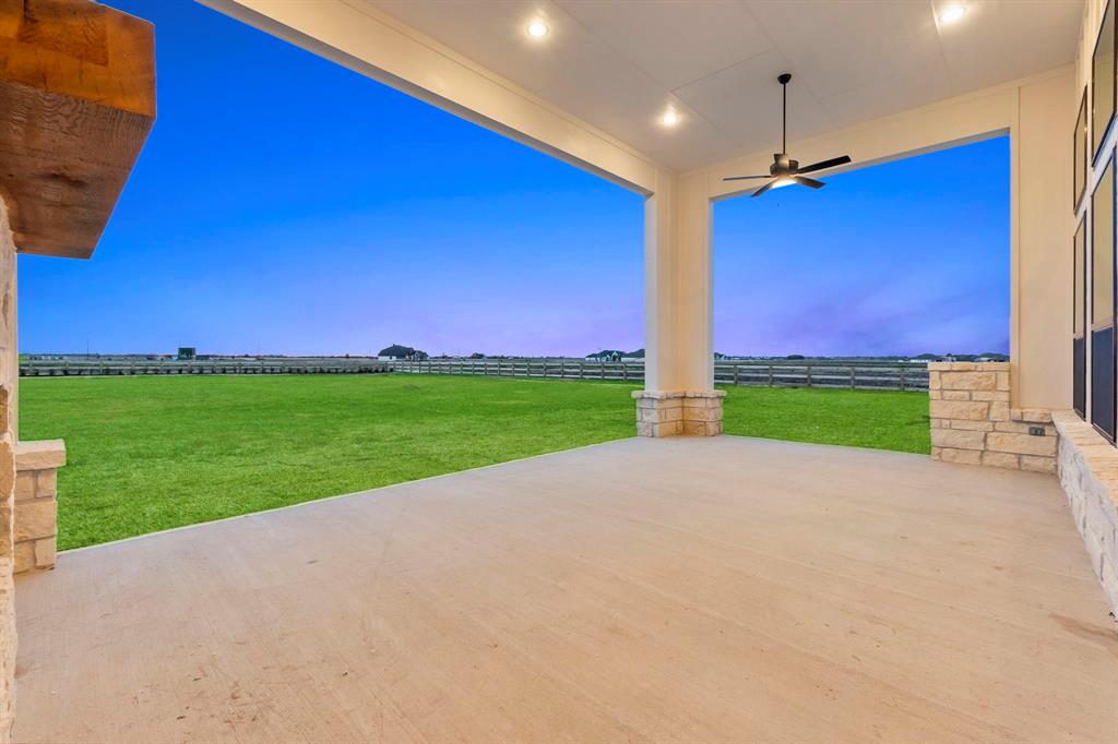 Expansive Covered Rear Patio with Fan