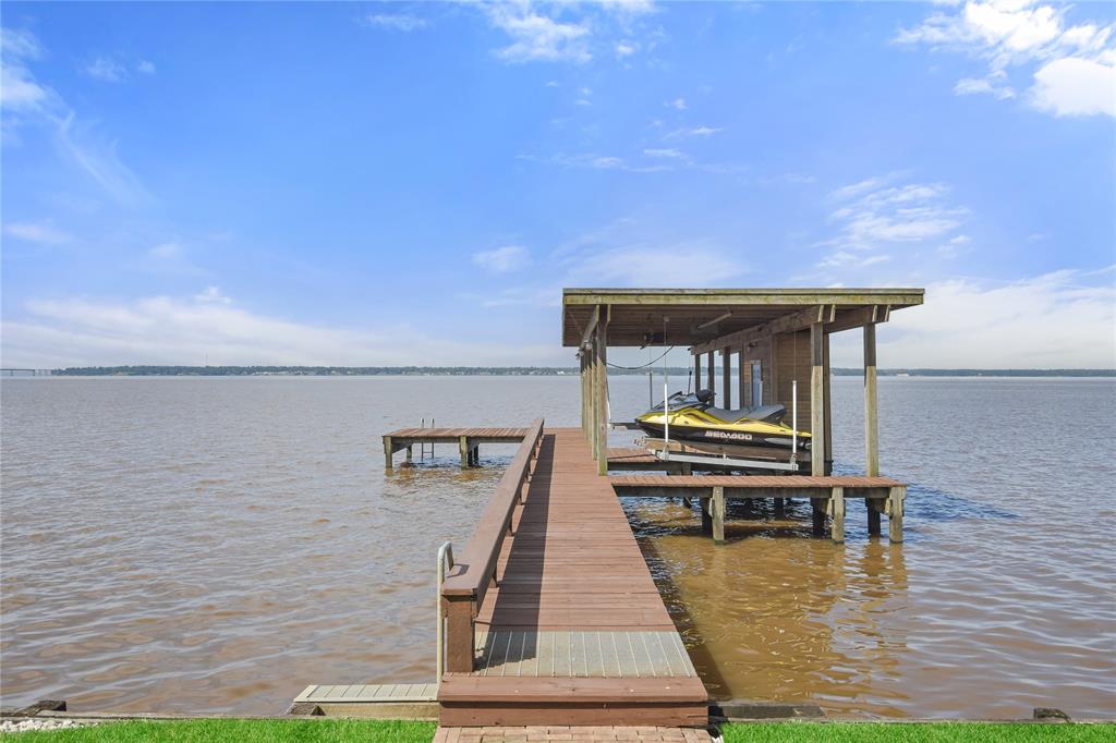 Wide walk way with convenient hand rail out to the boat or swim area