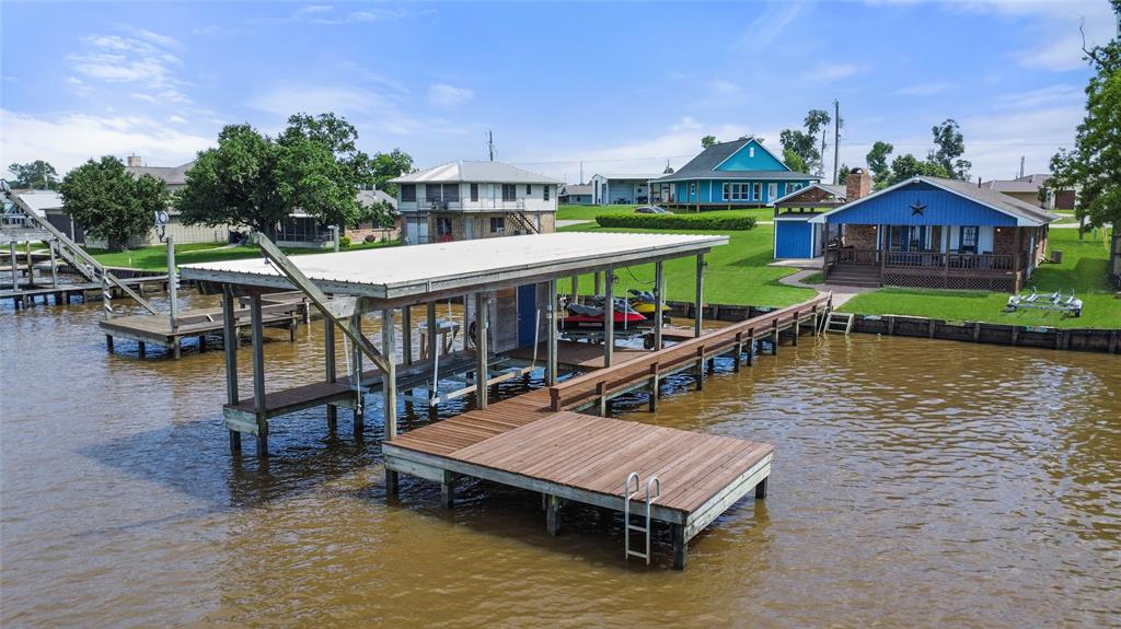 Large dock with both boat and jet ski lifts and plenty of fishing and sunning areas