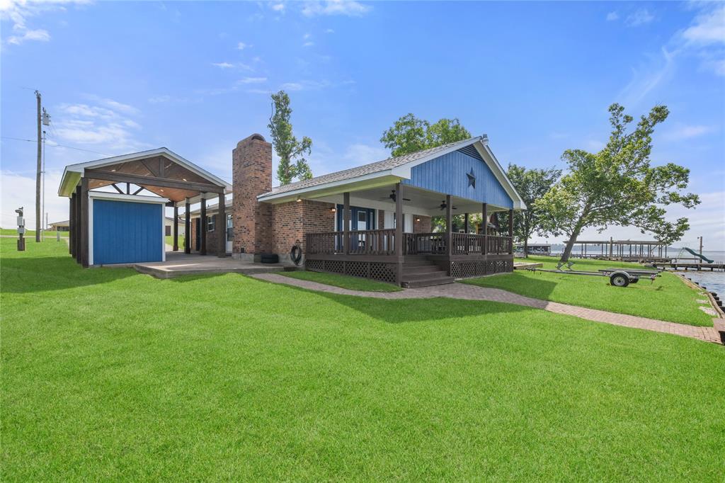 Amazing covered porch perfect for feeling the breeze on lazy days at the lake