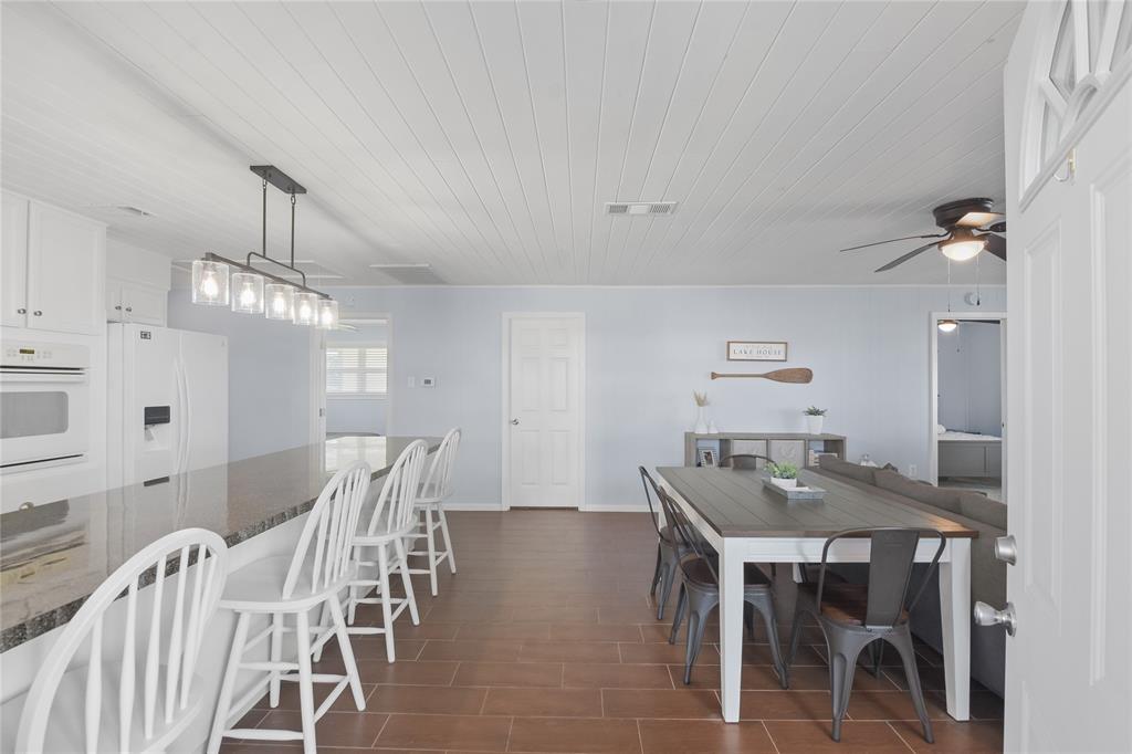 As you enter the kitchen frames the area to the left while the dining and living areas are to the right