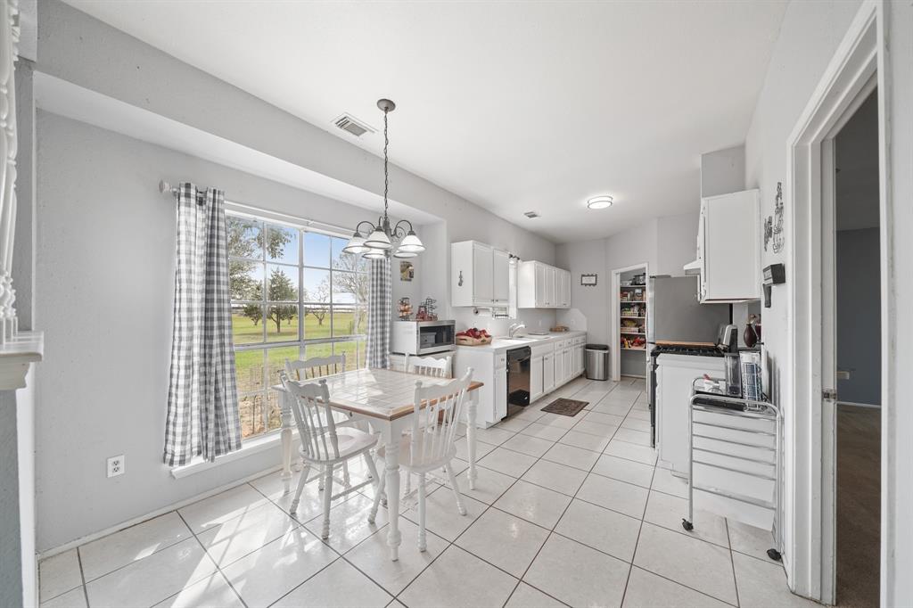 Kitchen and Dining Combo with large window that offers plenty of natural light