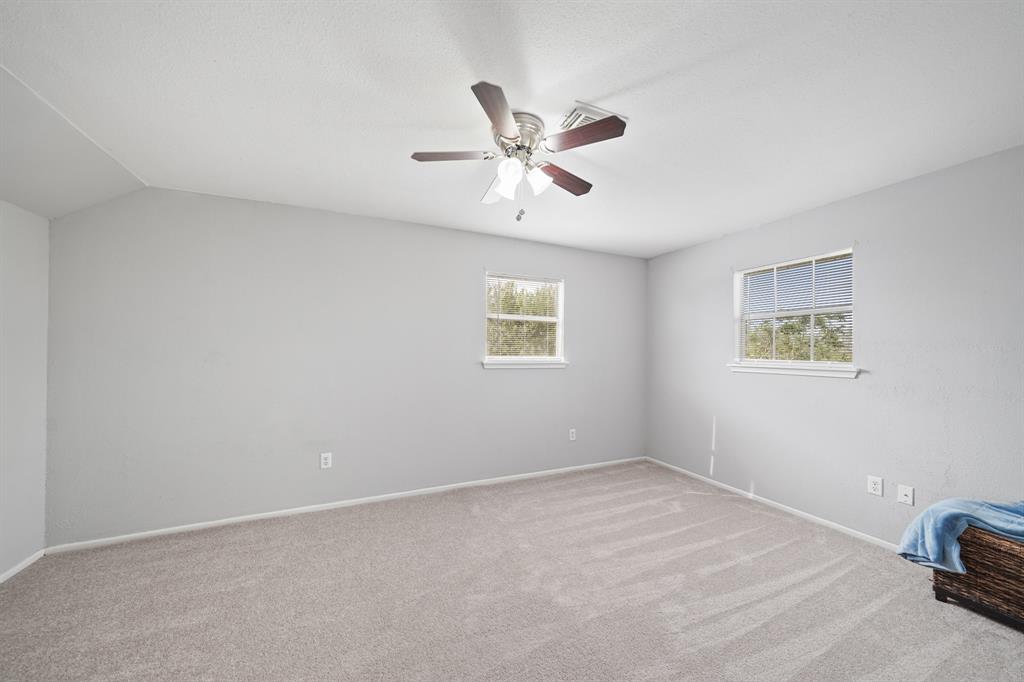 Third bedroom upstairs with ceiling fan